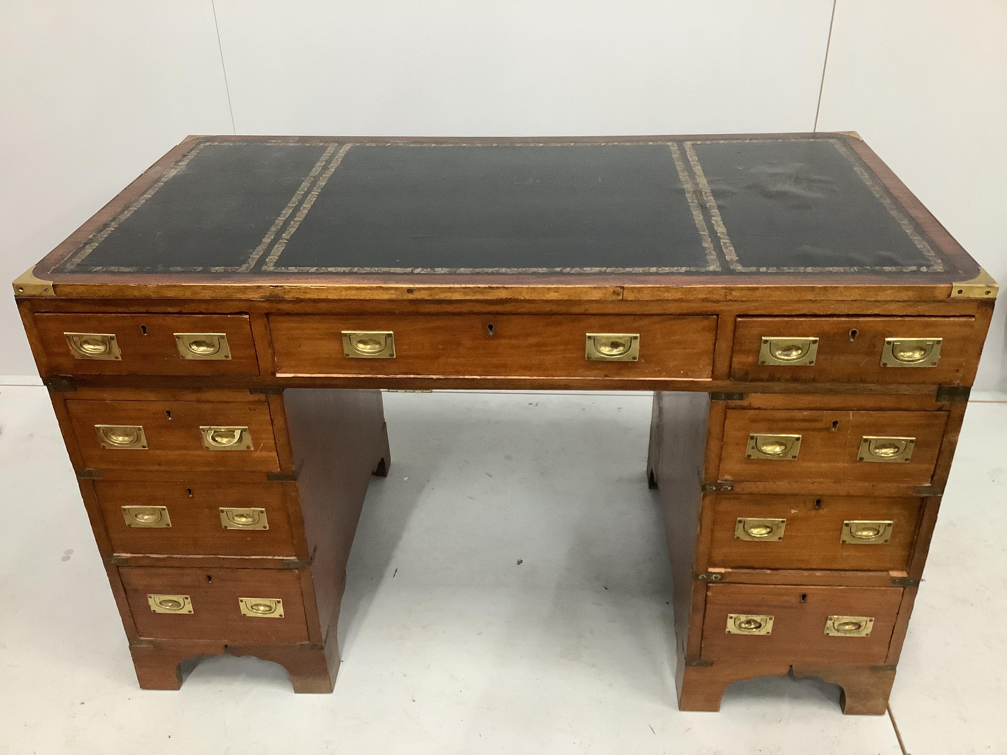 An early 20th century brass mounted mahogany military style pedestal desk, width 115cm, depth 61cm, height 73cm